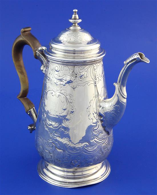 A George II silver coffee pot with later embossed decoration, gross 20.5 oz.